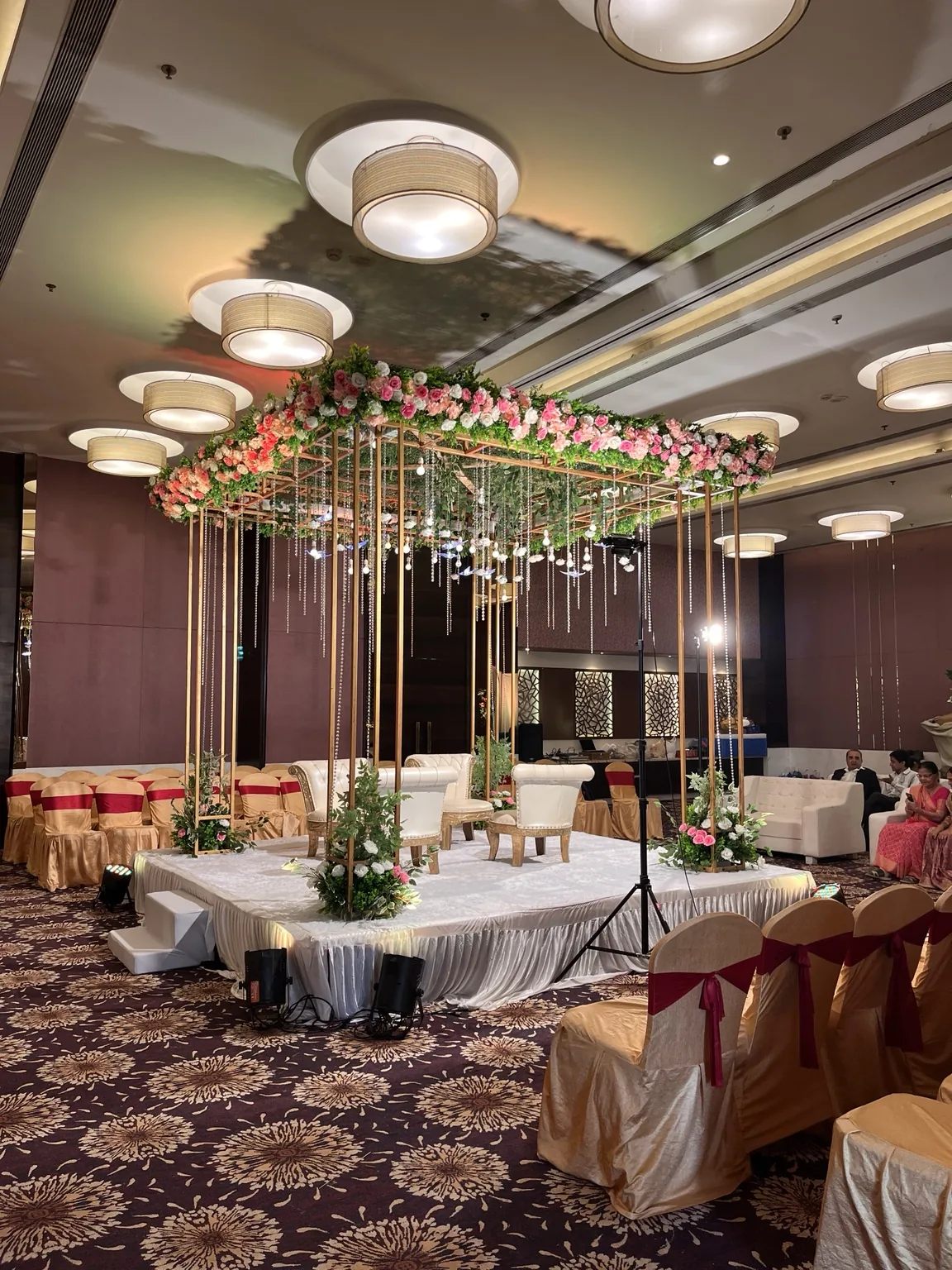 Luxury wedding stage with hanging florals